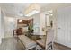 Charming dining area next to kitchen, featuring a glass table and bench seating at 12521 Floridays Resort Dr # 307F, Orlando, FL 32821