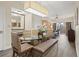 Dining area with modern light fixture, dining table and chairs at 12521 Floridays Resort Dr # 307F, Orlando, FL 32821