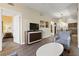 Cozy living room opens to a bedroom and dining area, featuring a modern dresser at 12521 Floridays Resort Dr # 307F, Orlando, FL 32821