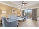 Inviting living room featuring a comfortable seating area and a balcony view at 12521 Floridays Resort Dr # 307F, Orlando, FL 32821