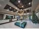Luxurious lobby area featuring a high ceiling, modern chandelier, reception desk, and stylish seating at 12521 Floridays Resort Dr # 307F, Orlando, FL 32821