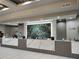 Bright hotel concierge features marble countertop and a decorative stone backdrop at 12521 Floridays Resort Dr # 307F, Orlando, FL 32821