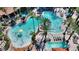 Aerial shot showcases a pool area with multiple pools, water features, palm trees, and lounge chairs at 12521 Floridays Resort Dr # 307F, Orlando, FL 32821