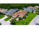 Aerial view of a home featuring a lush lawn and well-maintained landscaping at 1368 Del Mar Dr, Kissimmee, FL 34759