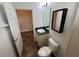 Bathroom featuring a mirror, toilet, and vanity at 1368 Del Mar Dr, Kissimmee, FL 34759
