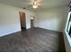 Bedroom with hard surface floors, closet and access to other rooms at 1368 Del Mar Dr, Kissimmee, FL 34759