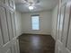 Bedroom with hard wood floors and a window view with bright natural light at 1368 Del Mar Dr, Kissimmee, FL 34759