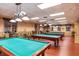 A billiards room with multiple pool tables and ample seating for residents at 1368 Del Mar Dr, Kissimmee, FL 34759