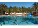 Large community pool surrounded by palm trees, perfect for relaxation and fun at 1368 Del Mar Dr, Kissimmee, FL 34759
