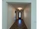 Long entryway featuring a decorative black front door and tile flooring at 1368 Del Mar Dr, Kissimmee, FL 34759