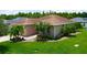 Charming single-story home with brick walkway, attached two-car garage, and manicured landscaping at 1368 Del Mar Dr, Kissimmee, FL 34759