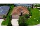 Beautiful single-story home with a brick driveway, well-manicured lawn, and mature landscaping at 1368 Del Mar Dr, Kissimmee, FL 34759