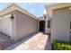 Exterior of a home exhibiting a two-car garage, paved driveway, and a secure front entry at 1368 Del Mar Dr, Kissimmee, FL 34759