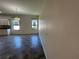 Bright living room with tile floors, a modern chandelier, and natural light from the windows at 1368 Del Mar Dr, Kissimmee, FL 34759