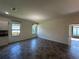 Open living area with tile flooring, recessed lighting and an elegant hanging light fixture at 1368 Del Mar Dr, Kissimmee, FL 34759
