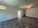 Spacious living room featuring tile floors and french doors at 1368 Del Mar Dr, Kissimmee, FL 34759