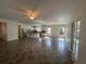 Open-concept living area with tiled floors connecting the living room, dining area, and kitchen at 1368 Del Mar Dr, Kissimmee, FL 34759