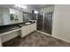 This main bathroom features double sinks, large mirrors, and a walk-in shower with glass doors at 1368 Del Mar Dr, Kissimmee, FL 34759
