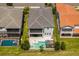 Aerial view of home highlighting backyard pool, patio, and surrounding landscaping in a desirable neighborhood at 15724 Cutter Sail Pl, Winter Garden, FL 34787