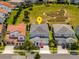An aerial view of a two-story home featuring well-maintained landscaping and proximity to a neighborhood park at 15724 Cutter Sail Pl, Winter Garden, FL 34787