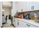 The bar area features custom cabinetry and a stylish backsplash at 15724 Cutter Sail Pl, Winter Garden, FL 34787