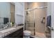 Bathroom with a glass-enclosed shower and a granite countertop sink at 15724 Cutter Sail Pl, Winter Garden, FL 34787