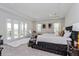 Bright primary bedroom with an ensuite bathroom and a balcony at 15724 Cutter Sail Pl, Winter Garden, FL 34787