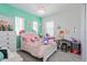 Cozy bedroom with colorful decor, perfect for a or teenager at 15724 Cutter Sail Pl, Winter Garden, FL 34787