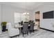 The dining room features a table set for dinner and a modern chandelier at 15724 Cutter Sail Pl, Winter Garden, FL 34787