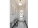 The entryway is designed with modern decor and a glass console table at 15724 Cutter Sail Pl, Winter Garden, FL 34787