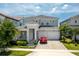 The exterior view shows a two-story home with a two-car garage and manicured landscaping at 15724 Cutter Sail Pl, Winter Garden, FL 34787