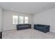 Neutral toned living area featuring two sofas, carpeting, and natural light at 15724 Cutter Sail Pl, Winter Garden, FL 34787