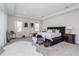 Main bedroom with carpeting, a dark bedframe, and a faux fur rug at 15724 Cutter Sail Pl, Winter Garden, FL 34787