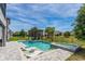 Backyard pool with a pergola and lounge chairs for relaxation at 15724 Cutter Sail Pl, Winter Garden, FL 34787