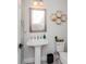 Powder room with unique sink and decorative honeycomb shelving at 15724 Cutter Sail Pl, Winter Garden, FL 34787
