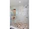 Modern tiled shower with a glass enclosure and built-in seat at 15724 Cutter Sail Pl, Winter Garden, FL 34787