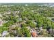 A captivating aerial view showcasing a charming neighborhood with mature trees and well-maintained homes at 1612 E Washington St, Orlando, FL 32803