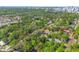 Expansive aerial view showcases the neighborhood's lush greenery and the home's desirable location at 1612 E Washington St, Orlando, FL 32803