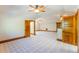 Large bonus room with neutral carpet features high ceilings, ceiling fans, and wood trim at 1612 E Washington St, Orlando, FL 32803