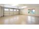 A spacious three-car garage with epoxy flooring and natural light from a window at 1612 E Washington St, Orlando, FL 32803