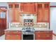 Gourmet kitchen with high-end stainless steel appliances and custom wood cabinetry at 1612 E Washington St, Orlando, FL 32803