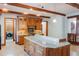 Well-appointed kitchen featuring custom wood cabinets and a center island at 1612 E Washington St, Orlando, FL 32803
