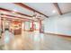 Bright, open living room featuring beautiful wood beam ceilings and a chef-inspired kitchen at 1612 E Washington St, Orlando, FL 32803