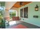 Inviting covered front porch with a swing and classic craftsman details at 1612 E Washington St, Orlando, FL 32803