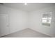 Neutral bedroom with tile floors and window at 16819 Sw 41St Avenue Rd, Ocala, FL 34473