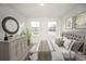 Serene bedroom featuring a cushioned headboard, neutral color palette, and decorative accents at 16819 Sw 41St Avenue Rd, Ocala, FL 34473