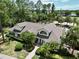 Aerial view of the condo's well-maintained exterior, landscaping, and proximity to a wooded area at 2040 Royal Bay Blvd # 30, Kissimmee, FL 34746
