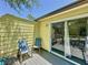 Relax on this shady balcony featuring outdoor seating and a sliding door for easy indoor-outdoor living at 2040 Royal Bay Blvd # 30, Kissimmee, FL 34746