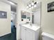 Bathroom featuring a single sink vanity with modern lighting at 2040 Royal Bay Blvd # 30, Kissimmee, FL 34746