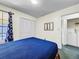 Cozy bedroom with a comfortable bed, closet, and attached laundry area for convenience at 2040 Royal Bay Blvd # 30, Kissimmee, FL 34746